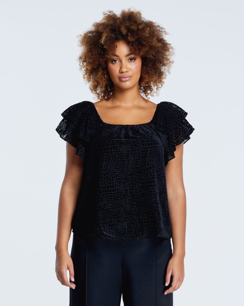 Front of a model wearing a size 1X Salome Burn-out Top in Black by Estelle. | dia_product_style_image_id:249855